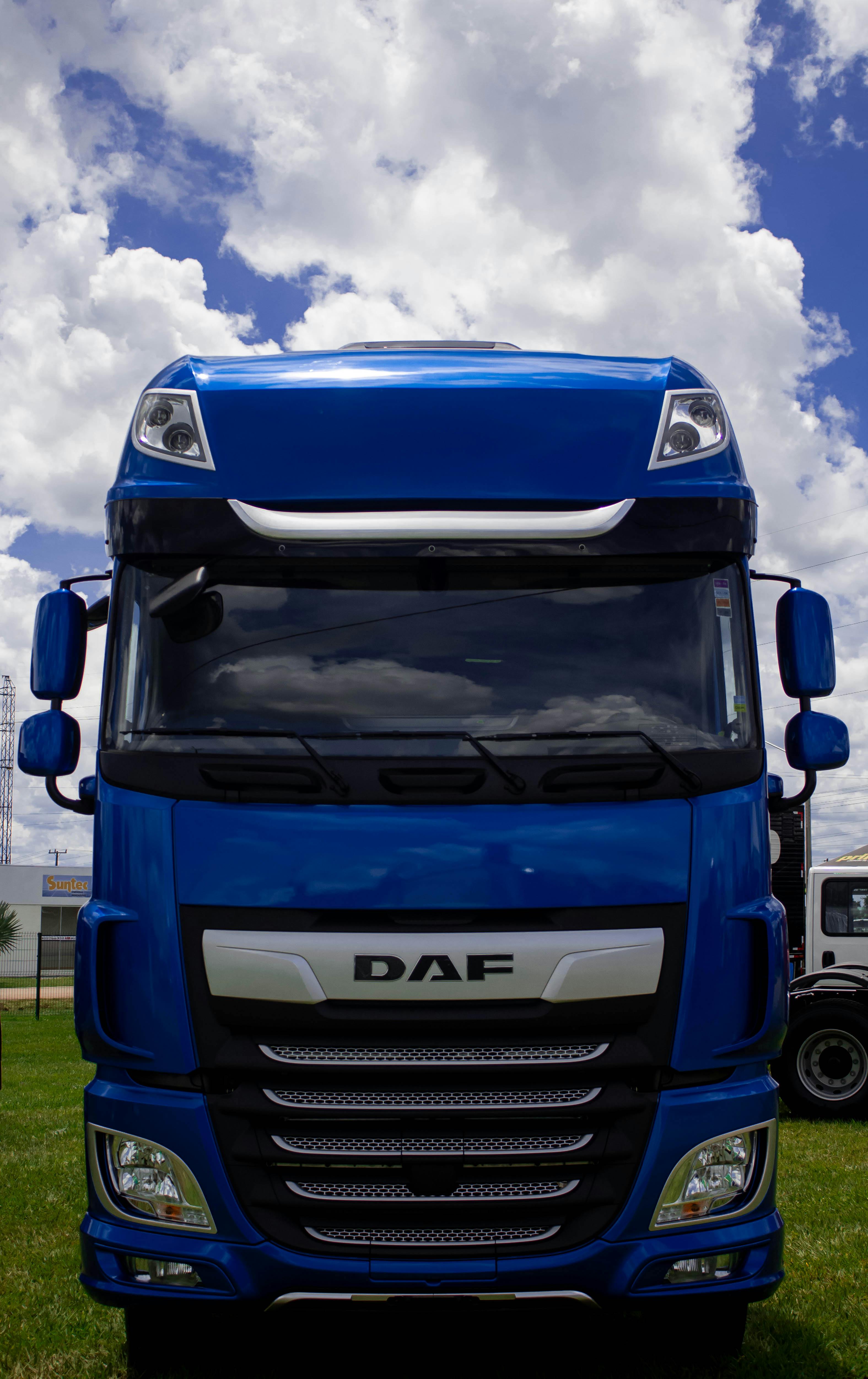 Front view of a blue DAF lorry under a cloudy sky, representing AM2PM Tyres's Lorry Tyres services in Reading.