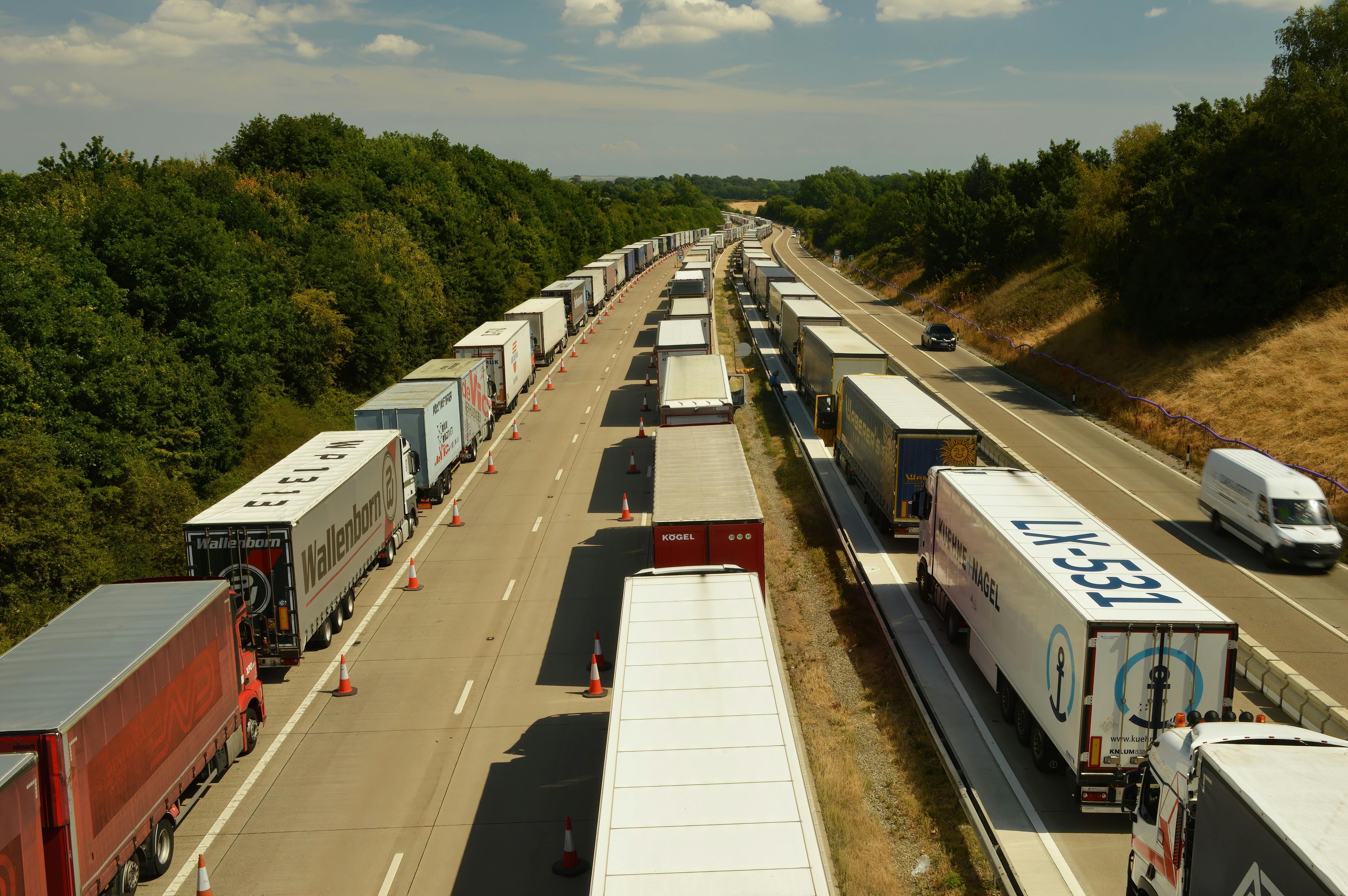 Lorries lined up on a motorway, illustrating the need for Lorry Tyres services by AM2PM Tyres in Reading.