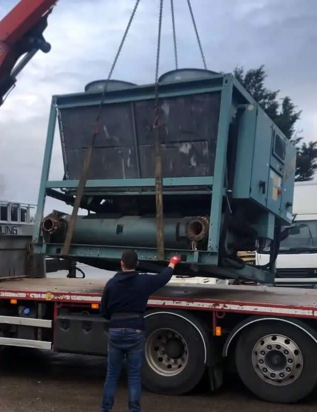 Large industrial equipment being loaded onto a lorry, illustrating London Metal &amp; Recycling Ltd's services for Scrap Commercial Kitchen &amp; Catering Equipment Recycling in Barking.