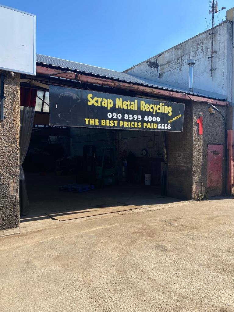 Exterior view of Essex Scrap Metals facility with signage for scrap metal recycling services in Harold Wood.