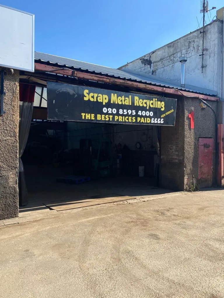 Exterior view of Essex Scrap Metals facility with signage for scrap metal recycling services in Becontree.