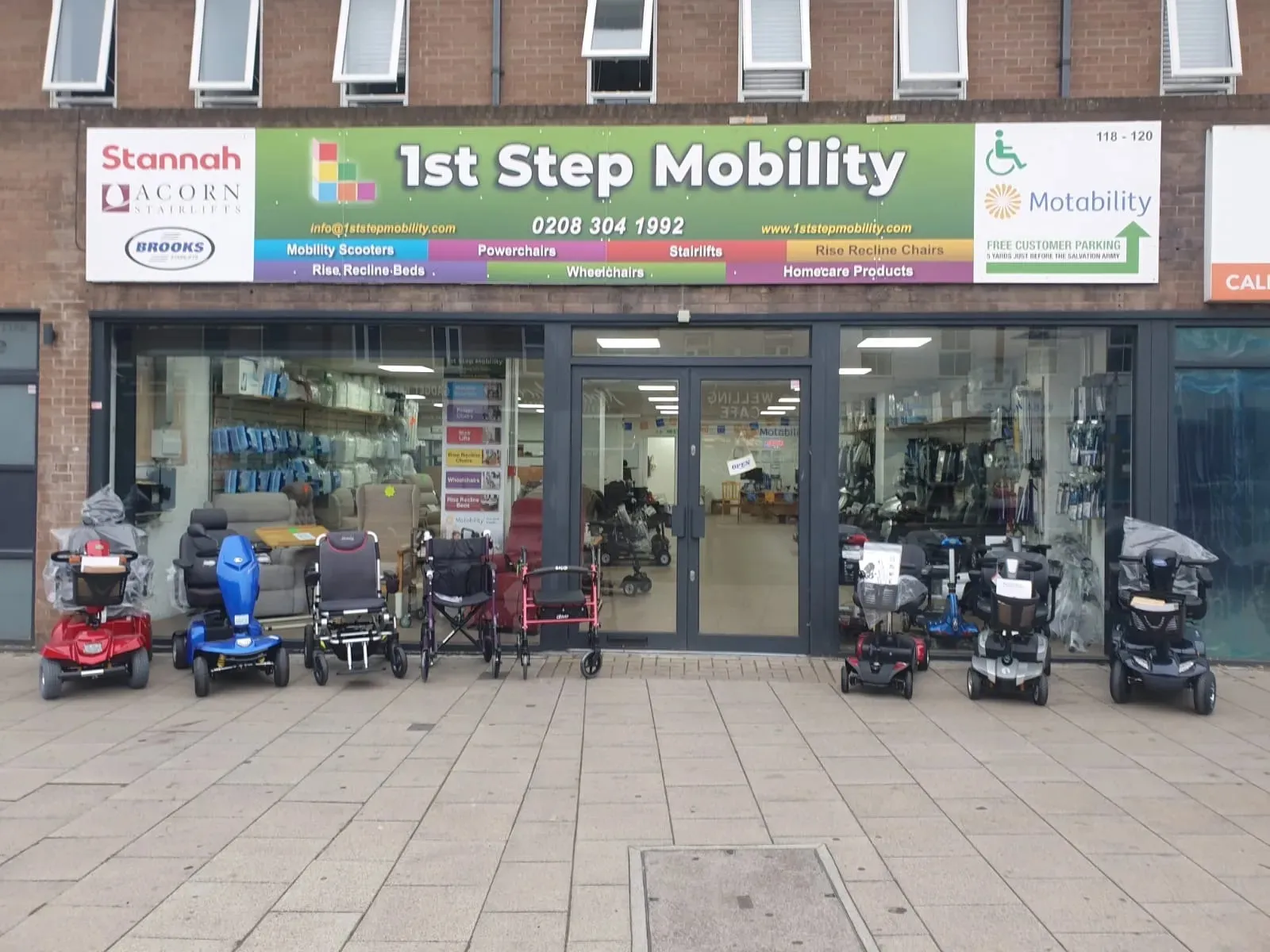 Exterior view of 1st Step Mobility Ltd. store showcasing various mobility scooters, located in South Ockendon.