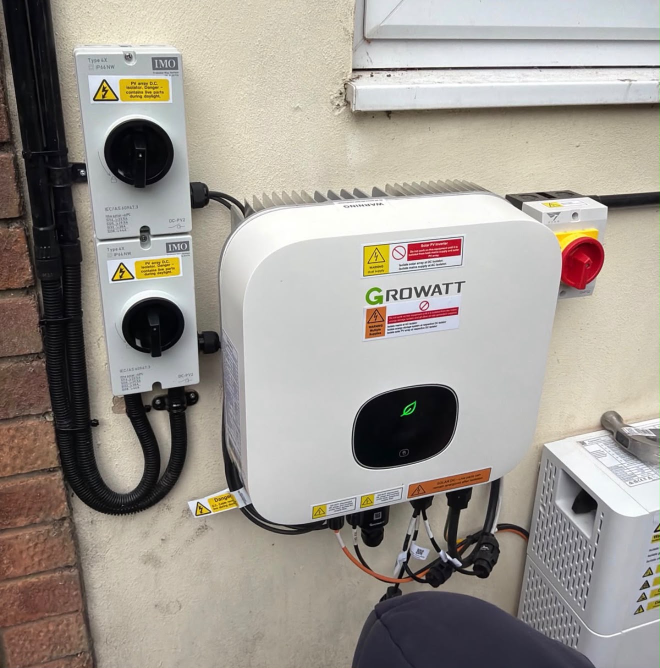 Solar inverter and electrical components installed on a wall, showcasing {{company_name}}'s expertise in {{search_term}} in {{place}}.