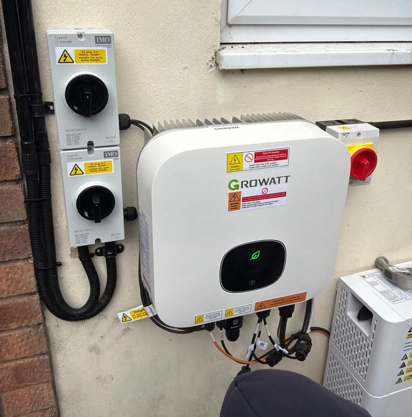 Solar inverter and electrical components installed on a wall, showcasing ICE Electrical Solutions's expertise in Solar Installation in St Ives.