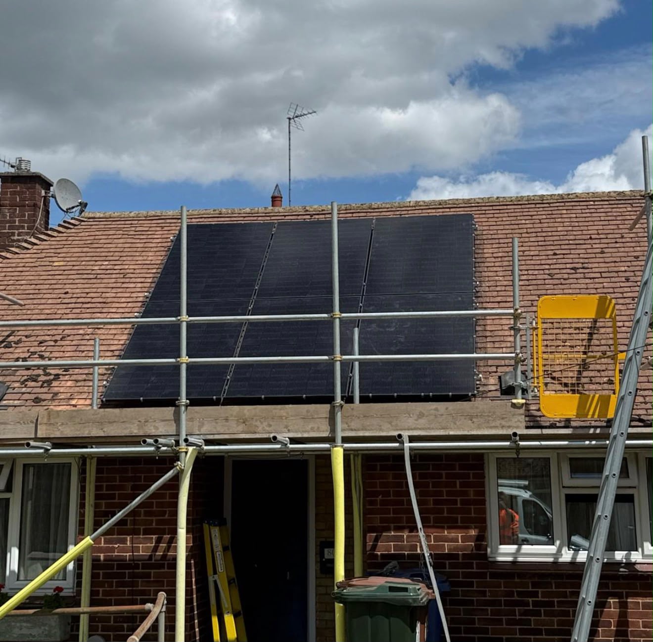 Solar panels installed on a residential roof with scaffolding, showcasing {{company_name}}'s expertise in {{search_term}} in {{place}}.
