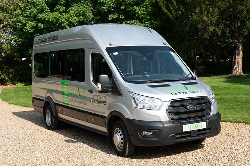 Silver minibus parked on gravel, available for 9 Or 17 Seater Minibus For Hire from Alley Cat Car &amp; Van Rentals in Whittlesford.
