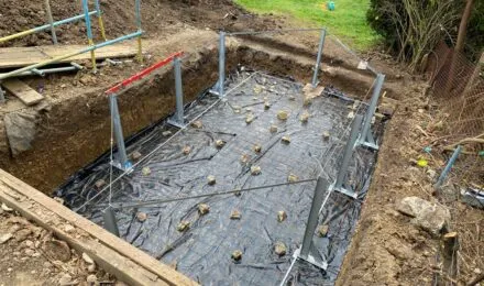 Excavation site prepared with groundwork and structural supports, showcasing services by MJ Digger &amp; Driver Hire Services in Cambridge.