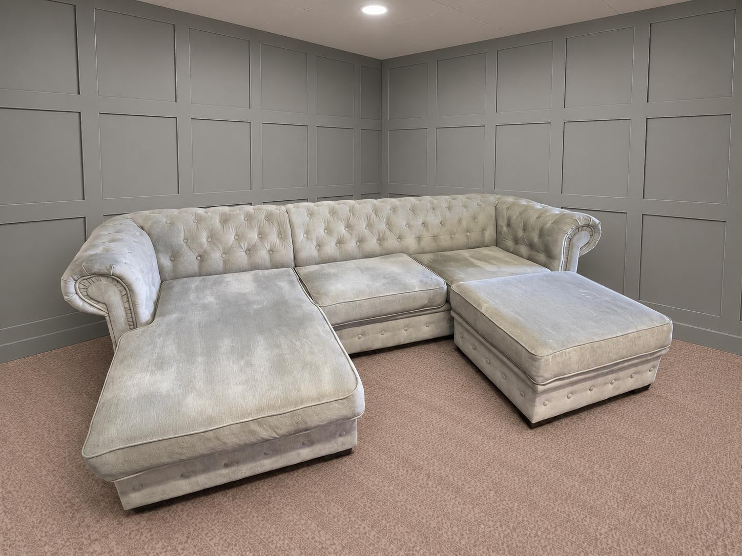 Light grey corner sofa with chaise sections in a showroom, for Corner Sofas For Sale from Restored Living in Clacton-on-Sea